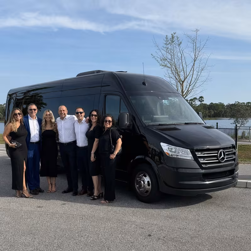 Group beside a Mercedes Sprinter limo from the Jacksonville fleet