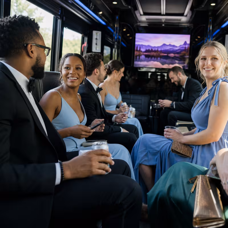 Wedding guests seated inside a Jacksonville party bus