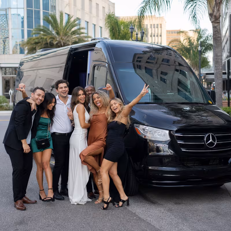 Group boarding a white charter bus for Bachelor & Bachelorette Transportation transportation in Jacksonville