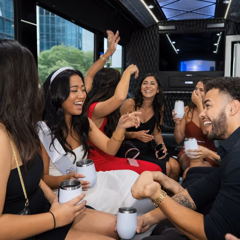 Party bus interior with wraparound leather seating and LED lighting in Jacksonville