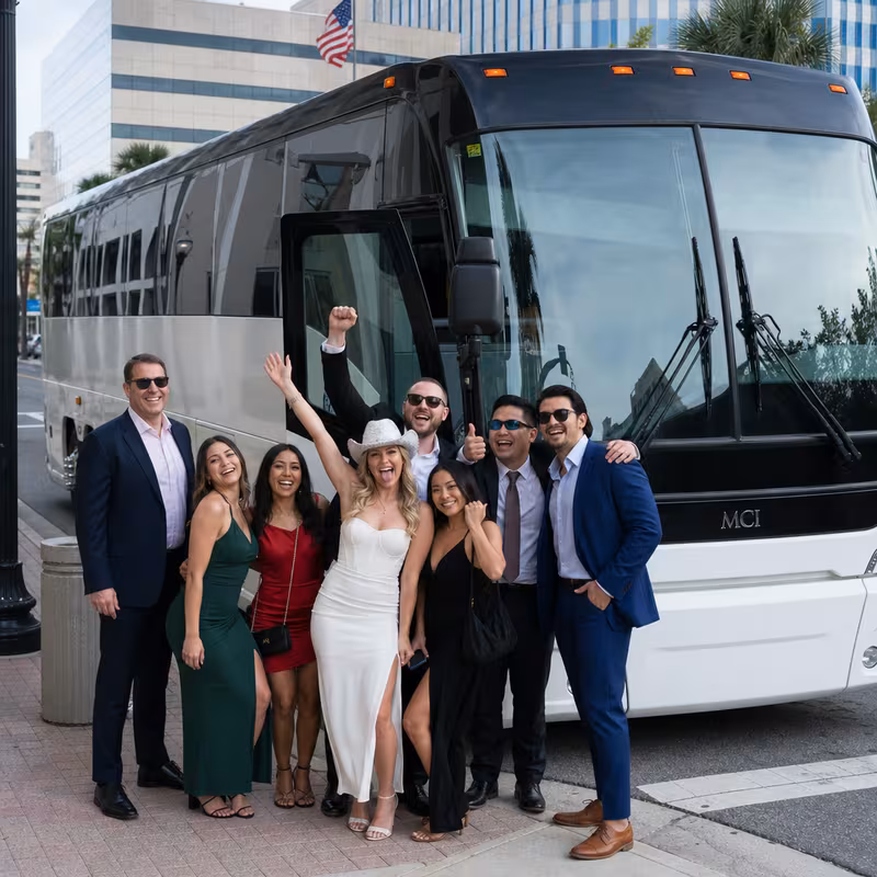 Passengers loading luggage while boarding an Jacksonville group shuttle