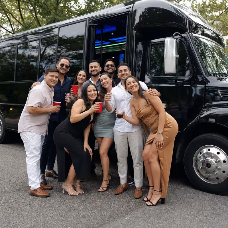 Group boarding a white charter bus for Birthday Transportation transportation in Jacksonville