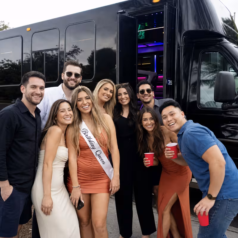 Party bus interior with wraparound leather seating and LED lighting in Jacksonville