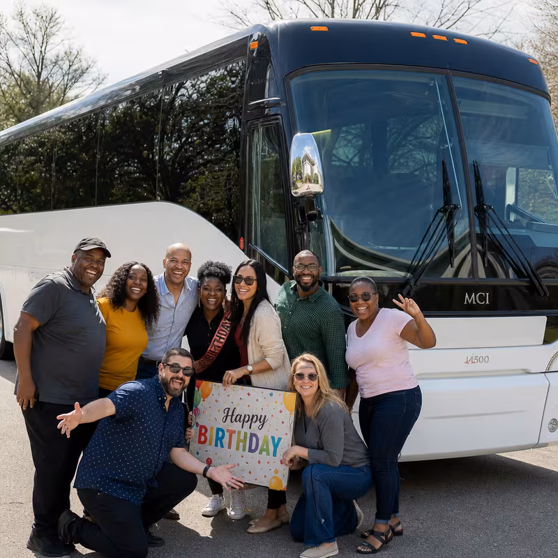Passengers loading luggage while boarding an Jacksonville group shuttle
