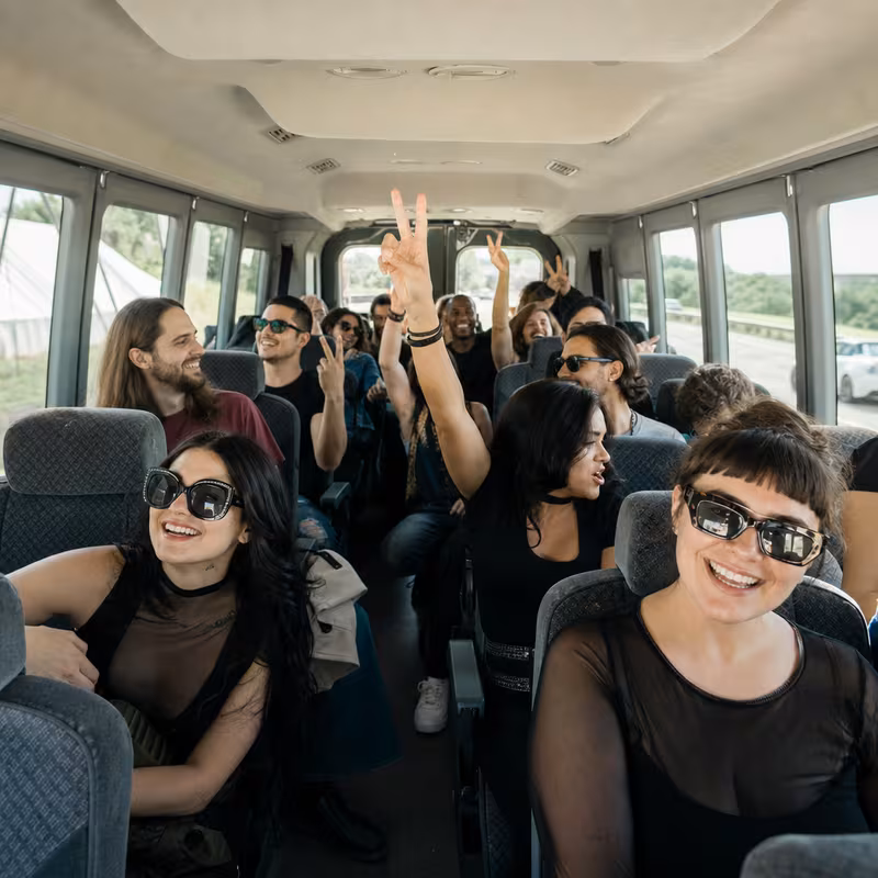 Party bus interior with wraparound leather seating and LED lighting in Jacksonville