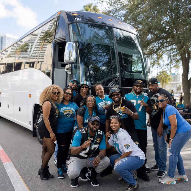 Passengers loading luggage while boarding an Jacksonville group shuttle