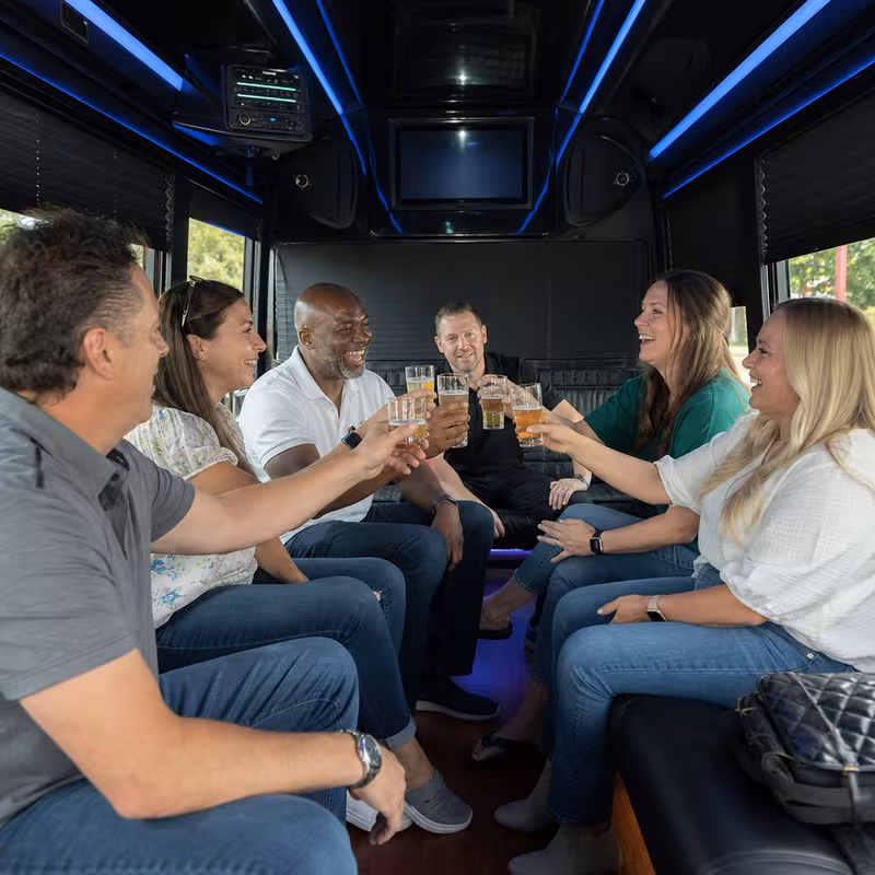 Group boarding a white charter bus for Winery & Brewery Tour Transportation transportation in Jacksonville