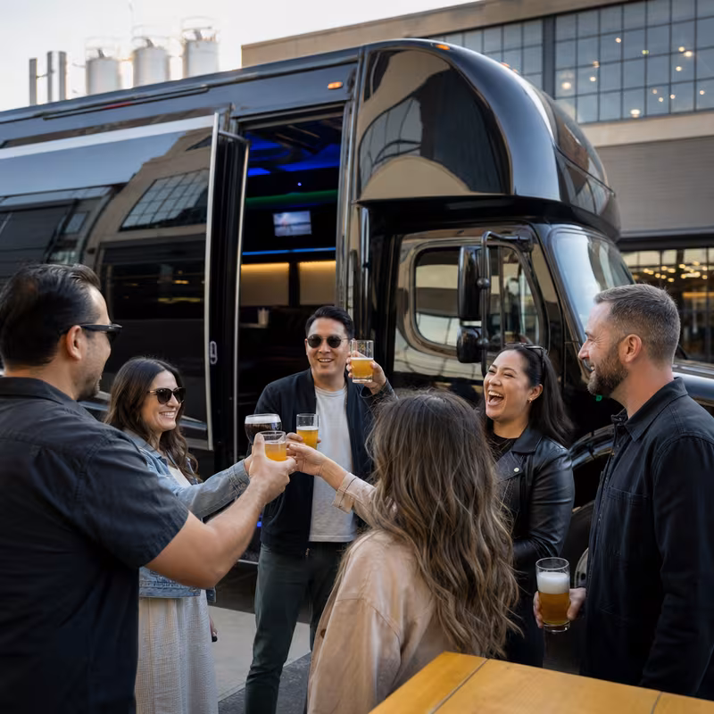 Passengers loading luggage while boarding an Jacksonville group shuttle